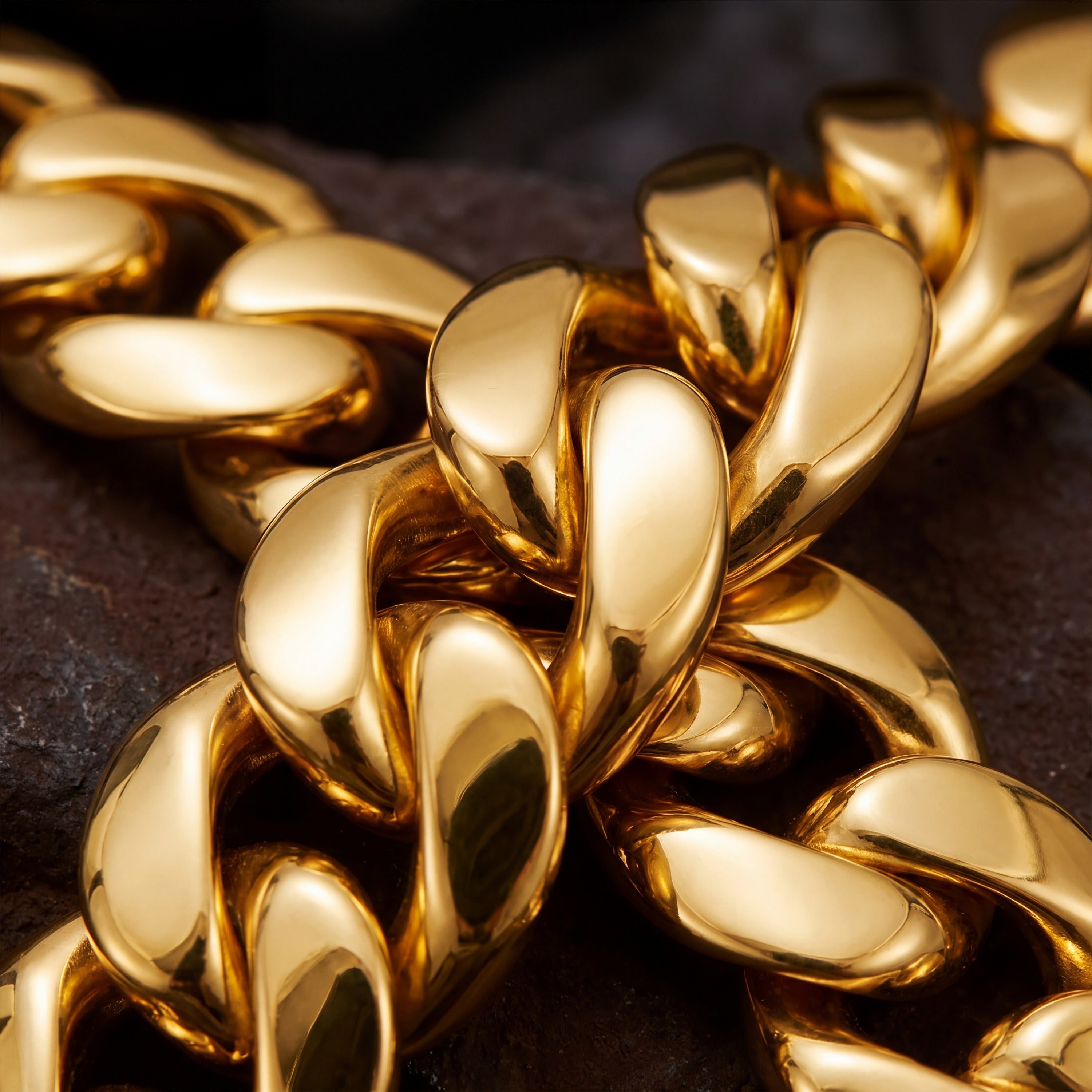 Macro of the smooth domed interlocking links on an 18K gold plated Cuban chain